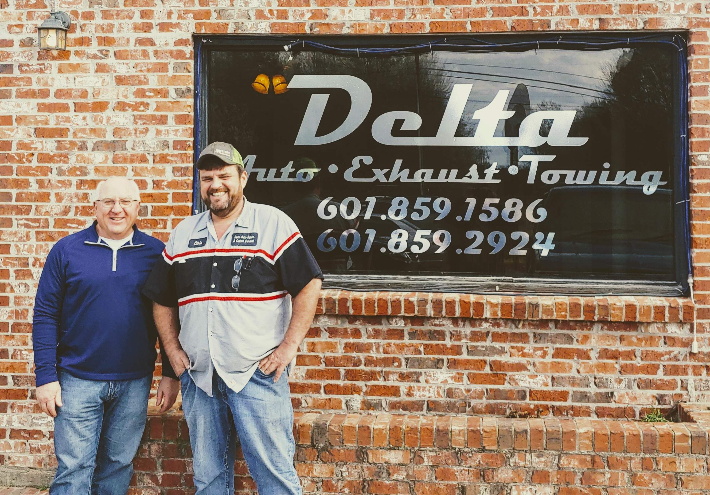 Denny and Chris in front of Chris's business in Mississippi