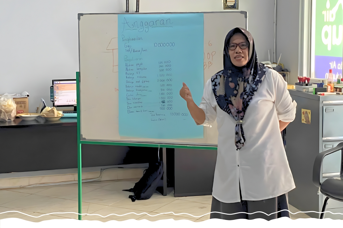 A woman presents in front of a whiteboard.